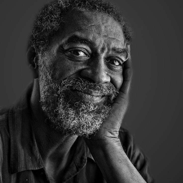 ALEX RIVER A, Lead Design Curator at HarborCrestMoss, reviewing corporate floral arrangements